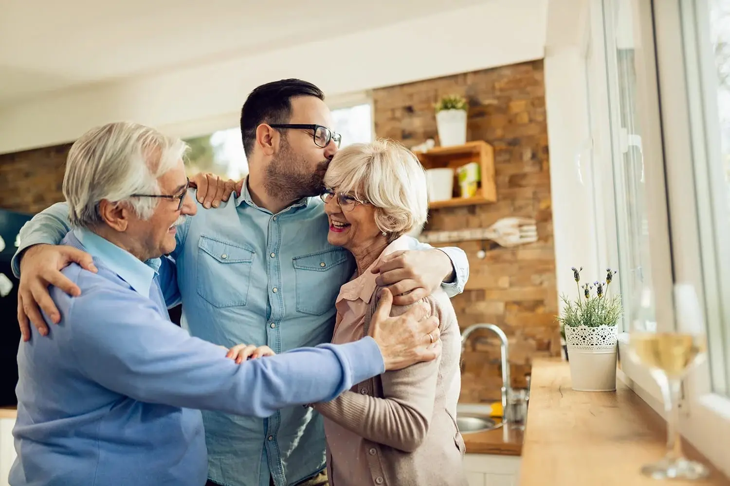An older couple walking together up the front steps of their home